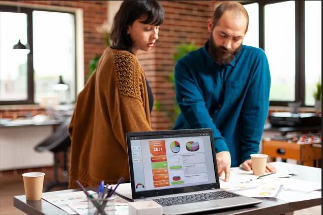 Business professionals reviewing sales analytics and reports