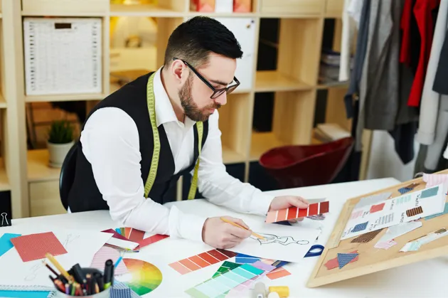 Fashion designer creating custom clothing design concepts